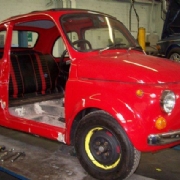 Accident damages Fiat 500 in workshop for major side repairs